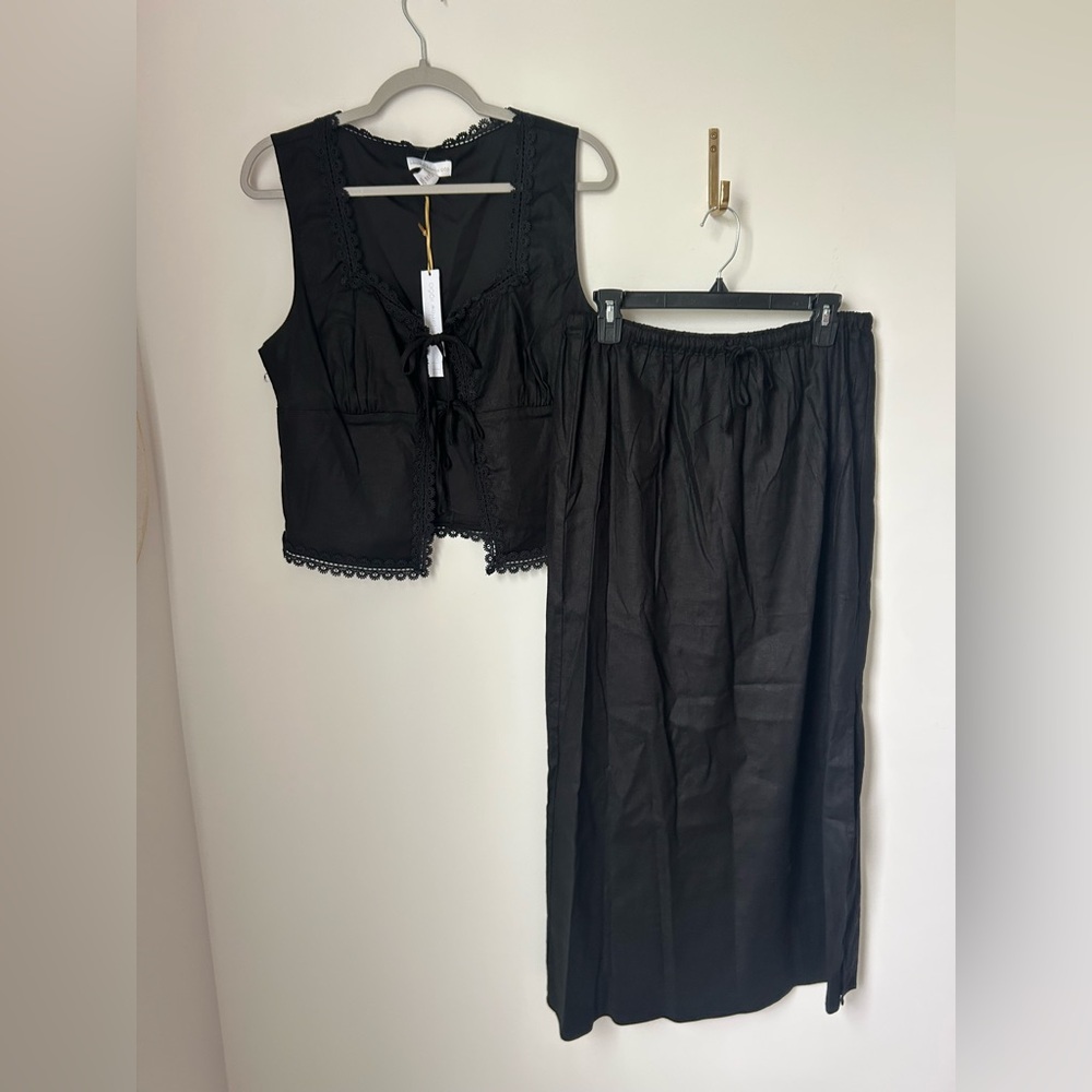 black sleeveless tie front top and midi skirt two piece set